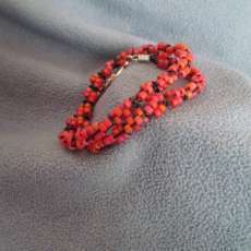 Rose Seed Beads with Black Jump Rings and Leather