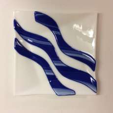 White fused glass plate with blue curves