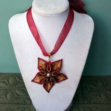 Red and gold flower pendant