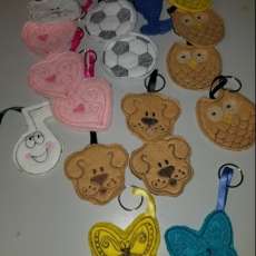 Machine embroidered key fobs/back pack tags