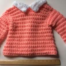 Girls Sweater, peach with white trim