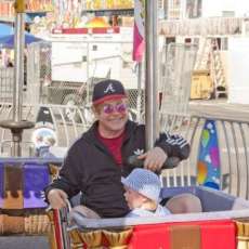 Elton John having family fun at the San Gennaro feast