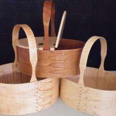 A group of Shaker Carriers in Curly Maple.