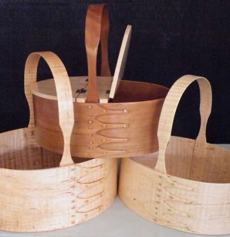 A group of Shaker Carriers in Curly Maple.