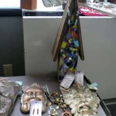 Mosaic birdhouse and garden stones