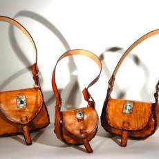 Small shoulder bags with cut stones