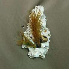 SILK AND NATURAL MATERIALS IN A STONE WALL HANGING