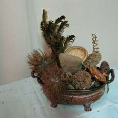 METAL CONTAINER WITH NATURAL MATERIAL COVERED BALLS AND FLOWERS