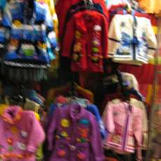 Children's sweaters handmade with the technique of arpilleras with different  applications, colorful and beautiful figures.