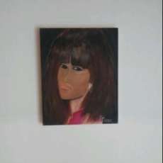 Young Woman With Diamond Earring Wearing Purple Blouse