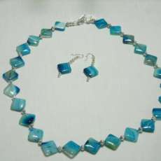 VERUGATED BLUE/WHITE DIAMOND SHAPED BEADS.