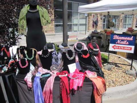 Table full of silk scarfs at show in winterpark