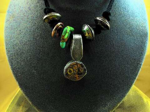 Steampunk necklace, with Mojave green, sterling silver a seventeen jeweled movement.