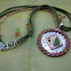 Sterling silver, brass, copper, leather, and green agate necklace and pendant.