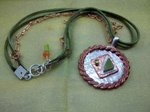 Sterling silver, brass, copper, leather, and green agate necklace and pendant.