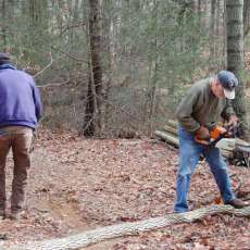 In the Forest cutting wood for candles