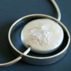 Large coin pearl as moon, sterling cage