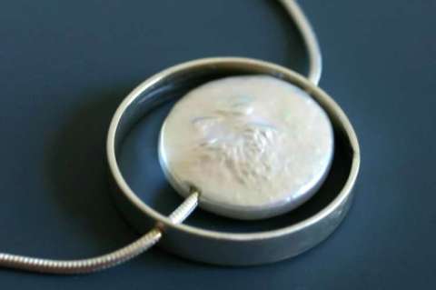 Large coin pearl as moon, sterling cage