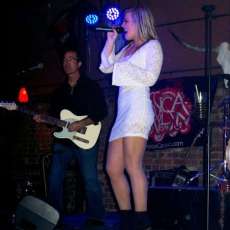 Profile of Jess with lead guitarist