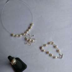 Sterling Silver Necklace with a handmade Butterfly pendant made of Sterling Silver, Freshwater Pearls and Swarovski. Ring and Bracelet.