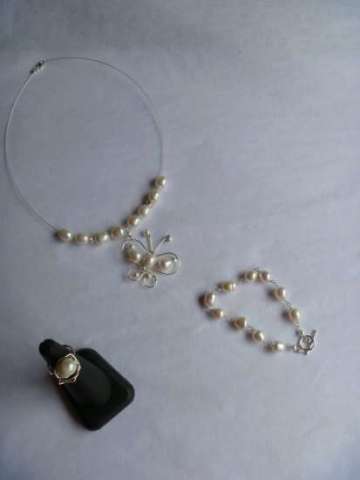 Sterling Silver Necklace with a handmade Butterfly pendant made of Sterling Silver, Freshwater Pearls and Swarovski. Ring and Bracelet.