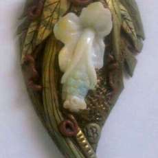 Polymer clay and carved boulder opal pendant