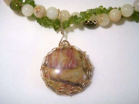 Peridot &  white onyx  with Picasso Jasper set in a Viking Weave
