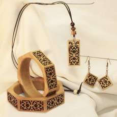 Beautiful and intrically carved, "Fillagree style" wood bracelet, with earings & pendant