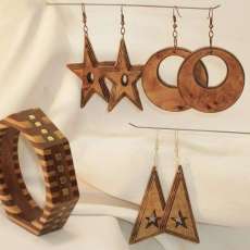 Beautifully carved "Geo style" wood earings with side & interior stepped details. Glazed clear finish