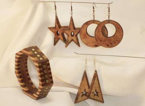 Beautifully carved "Geo style" wood earings with side & interior stepped details. Glazed clear finish