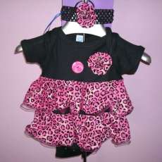 pink leopard fabric, tulle 2nd layer all rolled edged hems, all hand pinch pleated, hand made yo yo flowers.