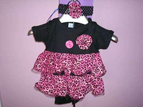 pink leopard fabric, tulle 2nd layer all rolled edged hems, all hand pinch pleated, hand made yo yo flowers.