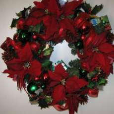 Poinsettia's and red ribbon   $60.00