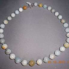 Aqua marine W/ swarovski crystals spacers with a sterling silver  clasp 21 inches long