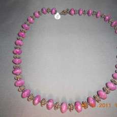 Purple stone with sterling silver and clear swarovski crystal spacers with a sterling silver clasp 23 inches