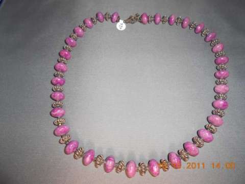 Purple stone with sterling silver and clear swarovski crystal spacers with a sterling silver clasp 23 inches