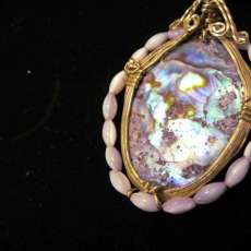 MOTHER OF PEARL & Seed Pearls on black rope $35