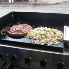 home made hot sausages with fresh green peppers and onions