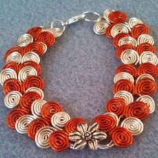 Egyptian Coil Bracelet Orange and Silver with Flower Charm