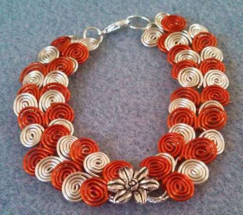 Egyptian Coil Bracelet Orange and Silver with Flower Charm