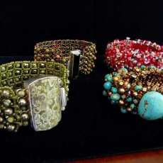 hand sewn cuffs with hand set cabachon and crystal clasps