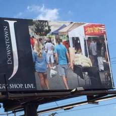 Happy Poppers Kettle Corn Billboard in Downtown Jonesboro, Arkansas
