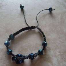 Blue crystal beads and black wx cord, shamballa inspired bracelet. Adjustable 6.5 to 10 in. wrists. $15.00usd