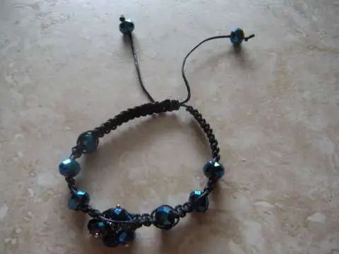 Blue crystal beads and black wx cord, shamballa inspired bracelet. Adjustable 6.5 to 10 in. wrists. $15.00usd