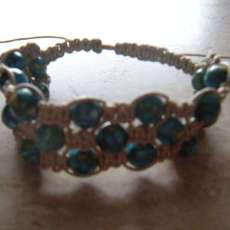 Light Blue crystal beads and beige wax cord triple bracelet. Adjustable from 6.5 to 10 in. wrists. $20.00usd