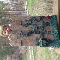 Curious girl looking over fence