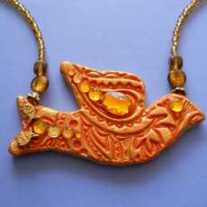 Golden Bird With Fish