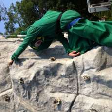 Gumby Climbing The Rock Wall