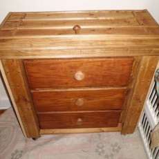 Small chest with hidden bed table.
