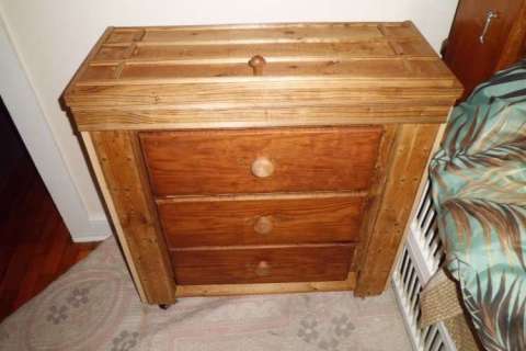 Small chest with hidden bed table.